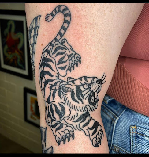 Explore leg tattoo ideas woman, creative tattoo ideas in Newburgh, available at Millennium Tattoo