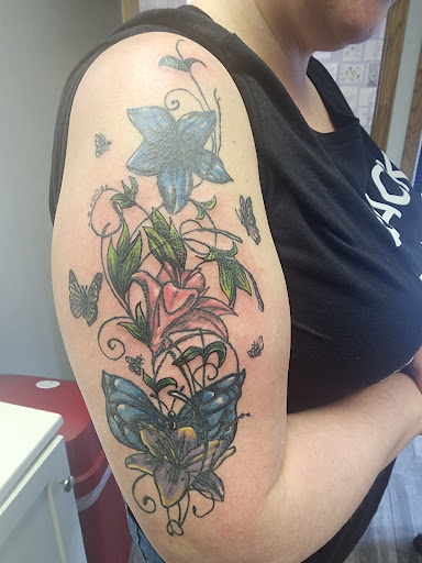 Explore hellscape battle sleeve tattoo ideas, creative tattoo ideas in Sioux City, available at Tattoo Monkey