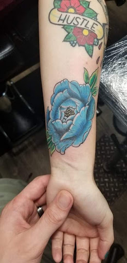 Explore cheek tattoo ideas, creative tattoo ideas in Athens, available at United Ink Tattoos and Body Piercings