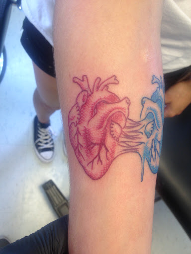 Explore purple flower tattoo ideas, creative tattoo ideas in Kent, available at War Horse Ink