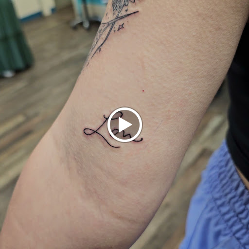 Explore red tattoo ideas women, creative tattoo ideas in Traverse City, available at Pinups & Needles