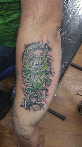 Explore cross tattoo sleeve ideas, creative tattoo ideas in Broken Arrow, available at Geek Ink Tattoo and Piercings
