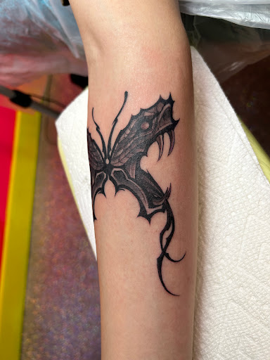 Explore party tattoo ideas, creative tattoo ideas in Houston, available at The Neon Jackal Tattoo