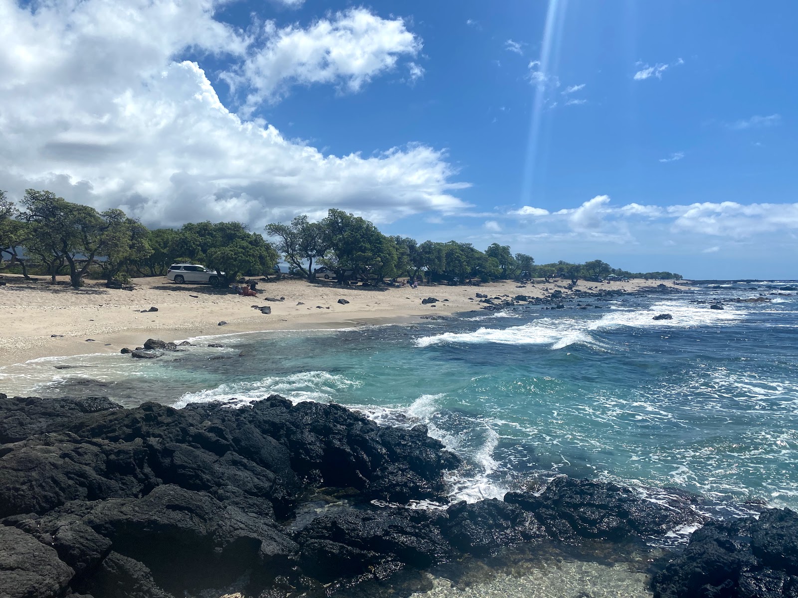 Foto von O'oma Beach mit türkisfarbenes wasser Oberfläche