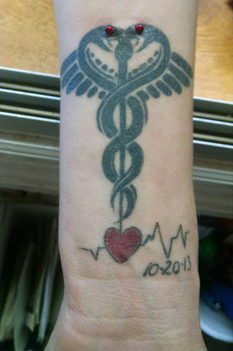 Explore five finger death punch tattoo ideas, creative tattoo ideas in Dillon, available at Stuck On You Body Piercing