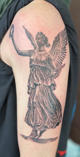 Explore batman sleeve tattoo ideas, creative tattoo ideas in Seaside, available at Creative Visions Ink Tattoo & Body Piercing Studio - Call for Appointment