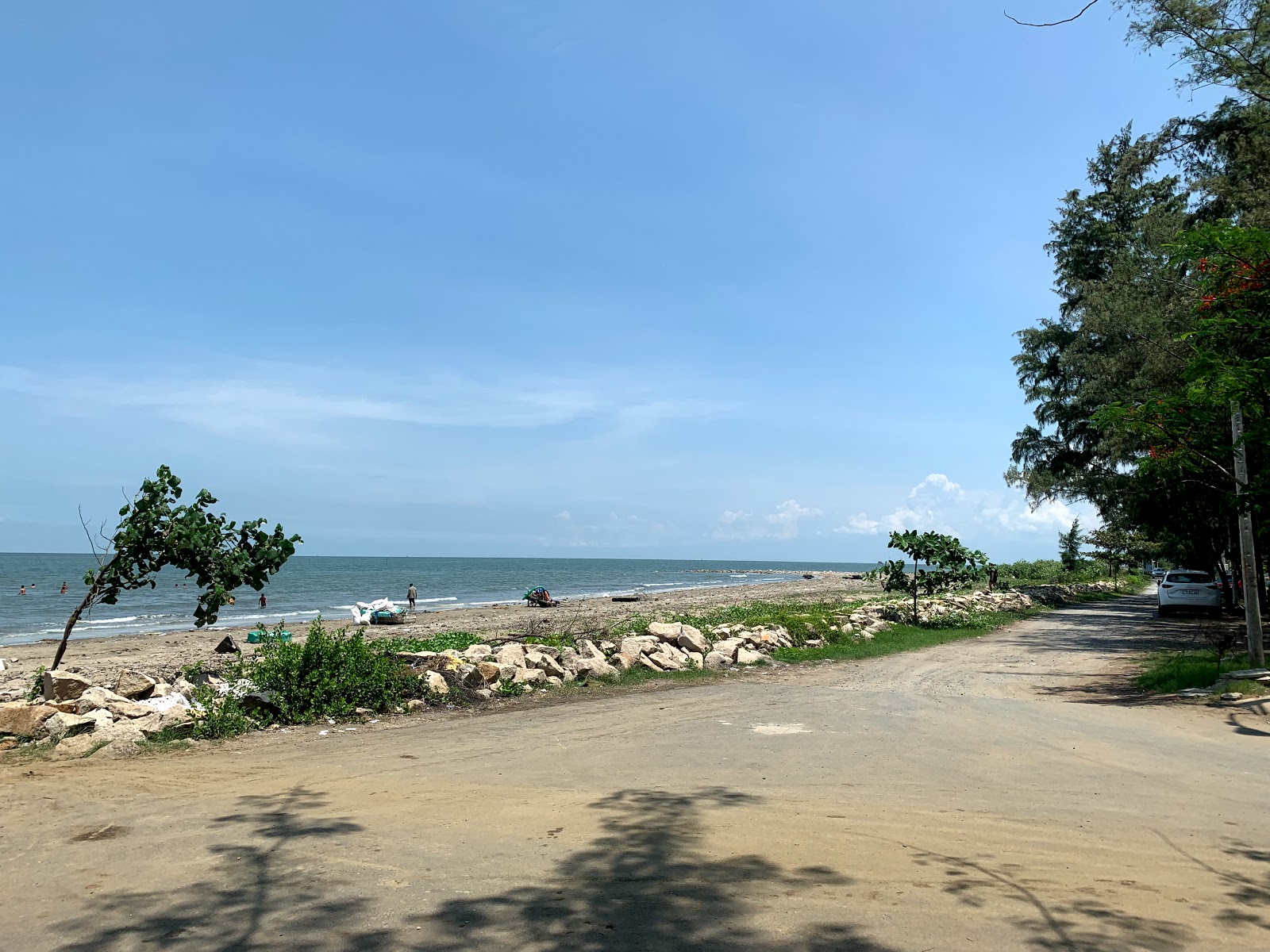 Fotografija Can Thanh beach z musta hiekka ja kivi površino