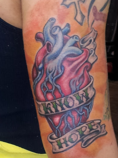 Explore wine tattoo ideas, creative tattoo ideas in Sulphur Springs, available at The Highwaymen USA Ink llc.