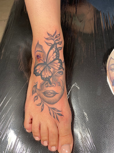 Explore tattoo ideas strong woman, creative tattoo ideas in Inglewood, available at Droopys tattoo shop
