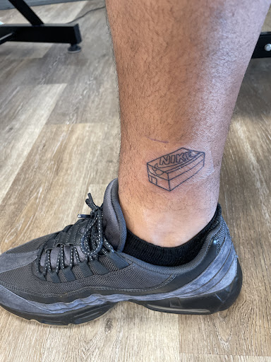 Find rib tattoo ideas for females for your next unique tattoo in Davenport at Fine Ink Studios Tattoos