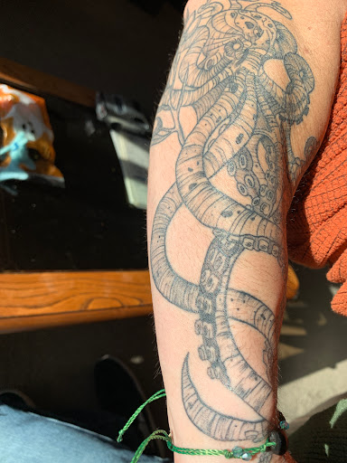 Explore tattoo name ideas on arm, creative tattoo ideas in Loveland, available at Satori Tattoo