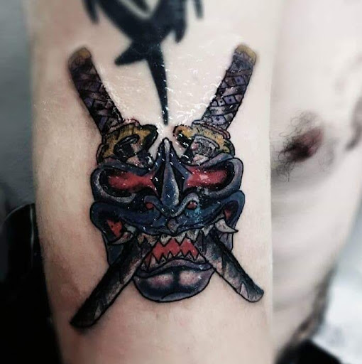 Find small wolf tattoo ideas for your next unique tattoo in Lockport at Famous Tattoos by Pinhead