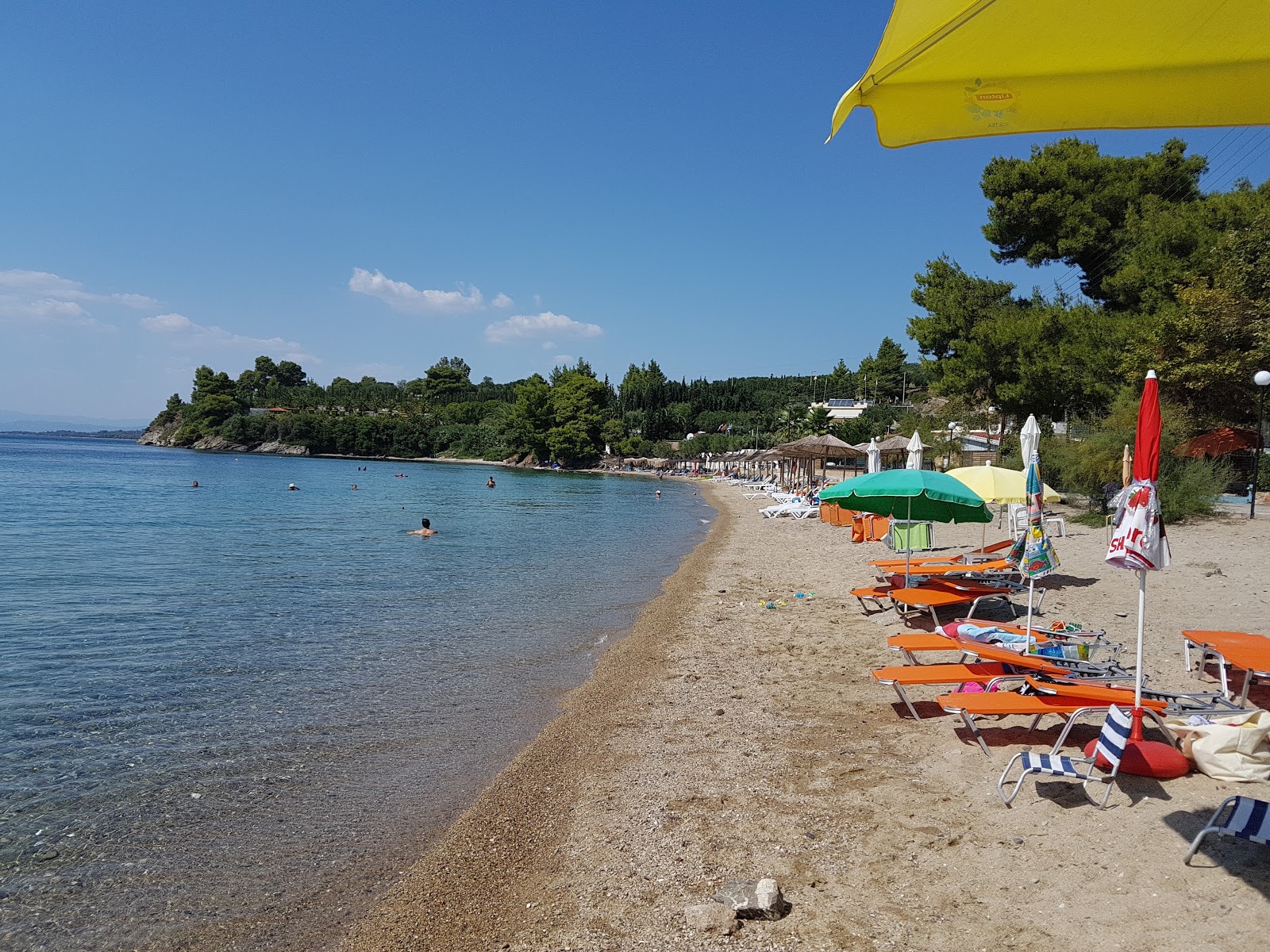 Fotografie cu Paralia Paradisos cu o suprafață de nisip beige