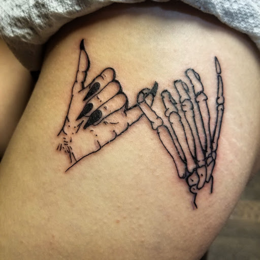 Explore tramp stamp tattoo cover up ideas, creative tattoo ideas in Cumberland, available at Queen City Ink