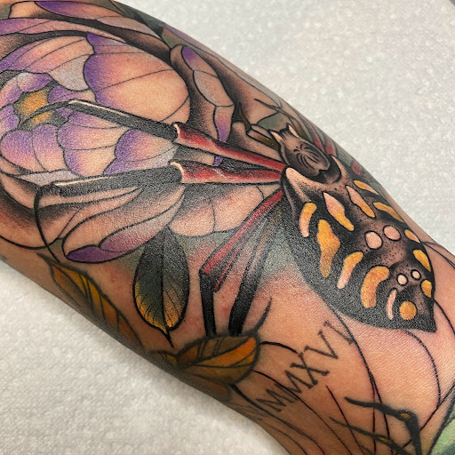 Explore under breast tattoo ideas for females, creative tattoo ideas in Saint Louis, available at Sign of the Times Tattoo