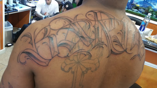 Explore football tattoo ideas, creative tattoo ideas in Oakland, available at Trilllogy Tattoo & Body Piercing