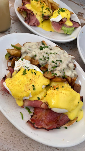 Eggs Benedict w/ potato & gravy 