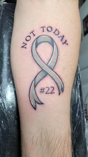 Explore word tattoo cover up ideas, creative tattoo ideas in Jeannette, available at GRAVESIDE TATTOO