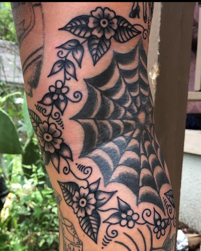 Explore tattoo ideas for women on thigh, creative tattoo ideas in Georgetown, available at Iron Rite Tattoo South