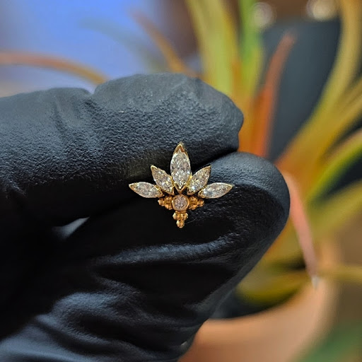 Explore rose sleeve tattoo ideas, creative tattoo ideas in Thousand Oaks, available at Golden Moon Piercings