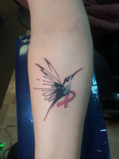 Explore cover up tattoo ideas for ladies, creative tattoo ideas in Decatur, available at Exclusive Ink Tattoos & Body Piercings 22nd & Wood