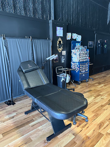 Explore middle neck tattoo ideas, creative tattoo ideas in Plattsmouth, available at Stabbed Ink