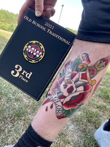 Explore neck word tattoo ideas, creative tattoo ideas in Lakeview, available at Backwoods Tattoo Studio