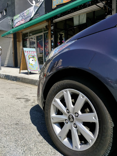 Explore wrap around arm tattoo ideas, creative tattoo ideas in Los Angeles, available at Tinta Rebelde hardcore tattoo