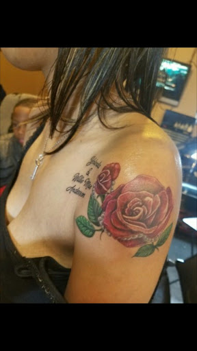 Explore tribal cross tattoo ideas, creative tattoo ideas in Atlanta, available at Camp Creek Body Art & Laser