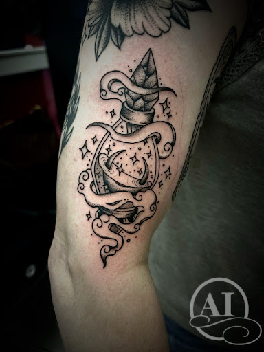 Explore spiral tattoo ideas, creative tattoo ideas in Katy, available at Artistic Impressions Tattoo Studio