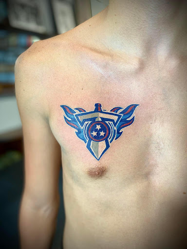 Explore red ink neck tattoo ideas, creative tattoo ideas in Ocala, available at Beauty in a Canvas Tattoo and Art Gallery