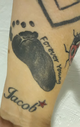 Explore deer head tattoo ideas, creative tattoo ideas in Wilkes Barre, available at South Main Street Tattoo