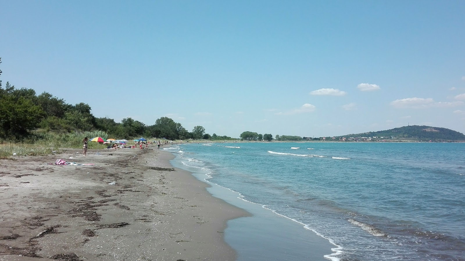 Fotografija Vromus beach z turkizna čista voda površino