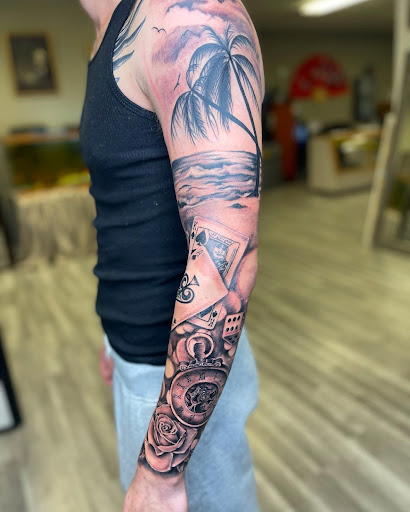 Explore single flower tattoo ideas, creative tattoo ideas in Watford City, available at Soulful Ink Studios