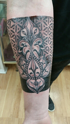 Explore jawline tattoo ideas, creative tattoo ideas in Muncie, available at The Tattoo Studio