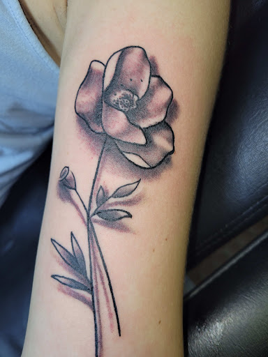 Explore foreign language tattoo ideas, creative tattoo ideas in Angola, available at Hoodlum Ink