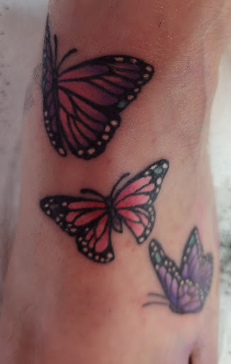 Find small tramp stamp tattoo ideas for your next unique tattoo in Tucson at Enchanted Dragon