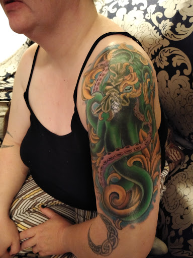 Explore little dragon tattoo ideas, creative tattoo ideas in Durham, available at Dogstar Tattoo Company