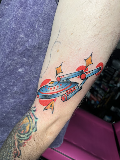 Explore spine tattoo ideas for men, creative tattoo ideas in Huntsville, available at Black Hearts Tattoo and Body Piercing