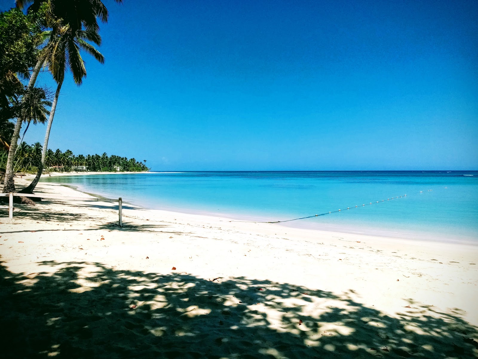 Foto van Playa Columpio Portillo en de nederzetting