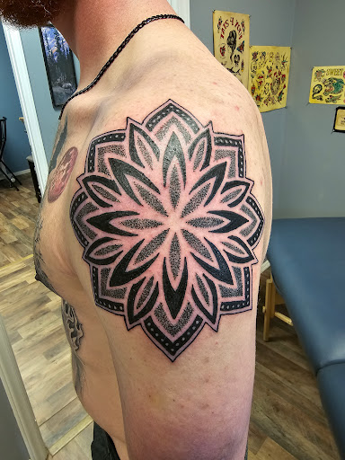 Explore hood tattoo ideas for men, creative tattoo ideas in Seymour, available at 3 Sevens Tattoo