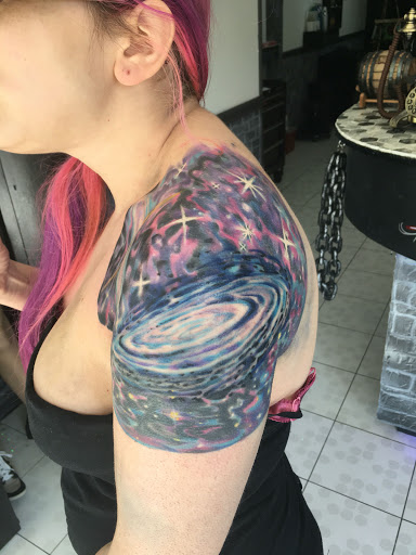 Explore purple rose tattoo ideas, creative tattoo ideas in Bronx, available at Anarchy Tattoo Studios