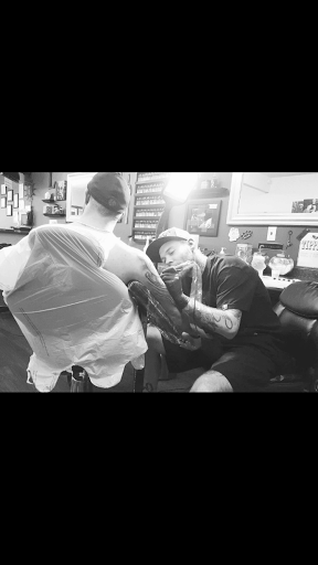 Explore man tattoo ideas arm, creative tattoo ideas in Roscoe, available at Elevated Ink Tattoo