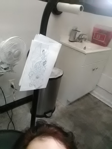 Explore blue flame tattoo ideas, creative tattoo ideas in Nicholasville, available at Reigning Ink Tattoo