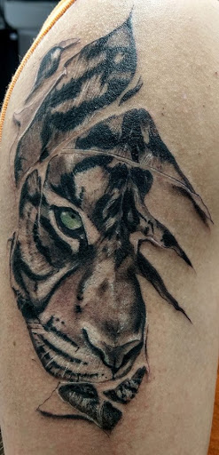 Explore cool forearm tattoo ideas for guys, creative tattoo ideas in Saint Paul, available at Iron Rhino Tattoo