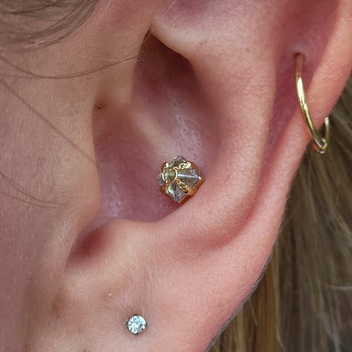 Explore bow tattoo ideas, creative tattoo ideas in Eugene, available at High Priestess Piercing & Tattoo