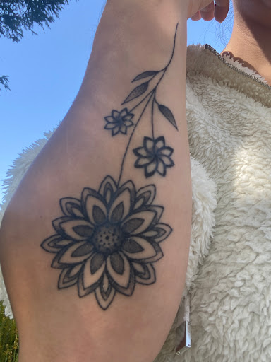 Explore hand tattoo ideas for woman, creative tattoo ideas in San Diego, available at Sideshow Tattoo and Piercing