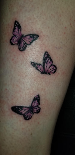 Explore first son tattoo ideas, creative tattoo ideas in Angola, available at Hoodlum Ink