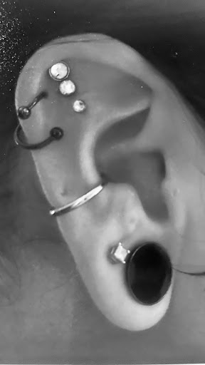 Explore gnome tattoo ideas, creative tattoo ideas in San Clemente, available at Distinctive Body Art Studio Tattoo & Piercing