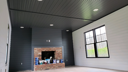 Photo of John Patricks Painting and kitchen cabinets